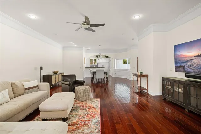a view of a big yard with plants and large trees