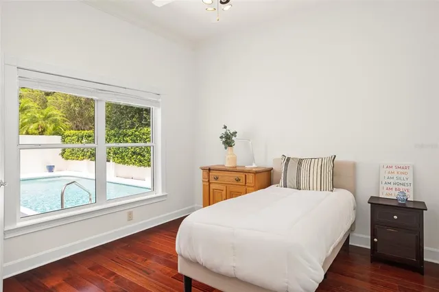 a bathroom with a shower sink and mirror