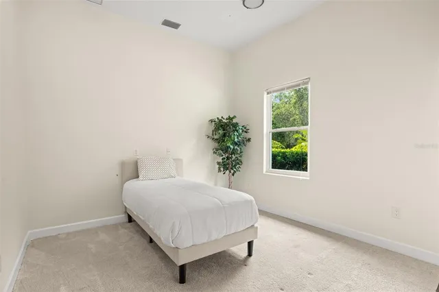 a view of a lake with a yard and trees