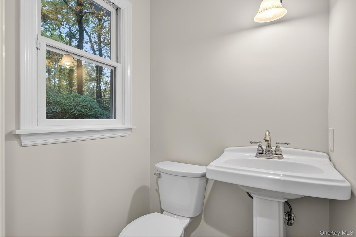 43 Edcris Lane Huntington, NY 11724 - Photo 21 of 37 a bathroom with a sink a toilet and a mirror