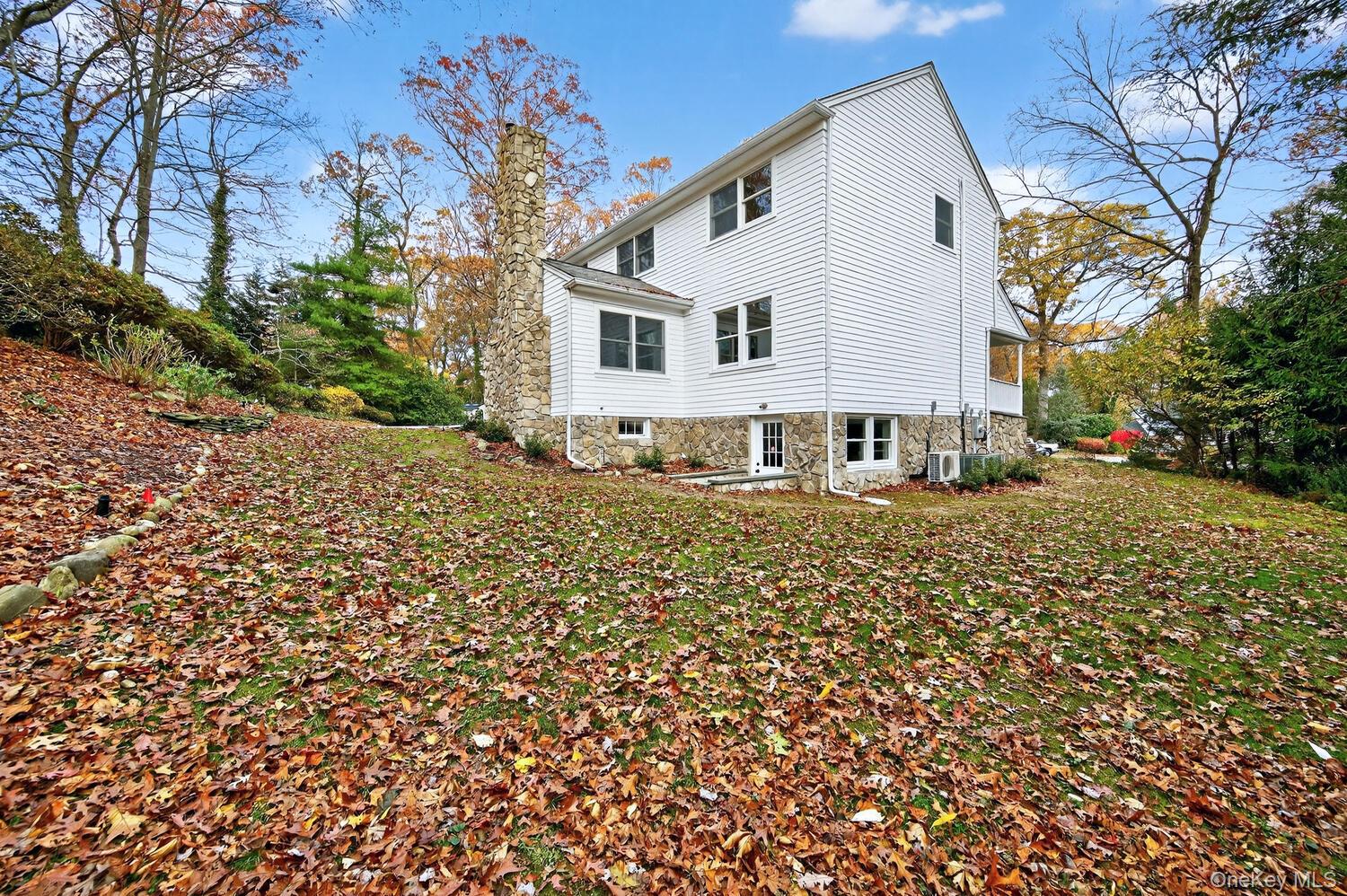 43 Edcris Lane Huntington, NY 11724 - Photo 37 of 37 a front view of a house with a yard