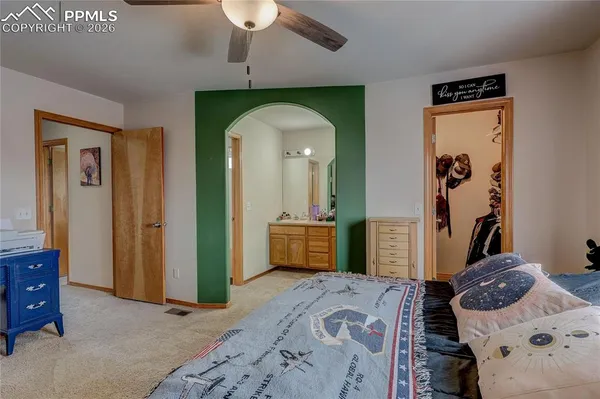 a bedroom with bed and furniture