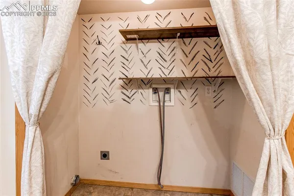 a bathroom with a granite countertop sink and mirror