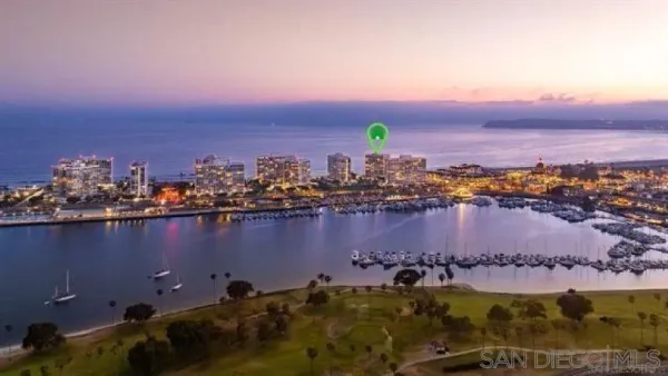 an aerial view of ocean and city