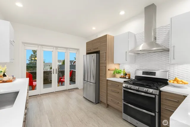 a kitchen with stainless steel appliances a stove and a refrigerator