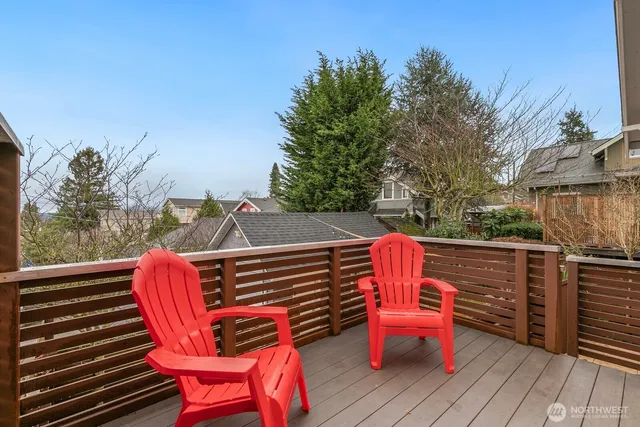 a outdoor sitting area with furniture on wooden deck