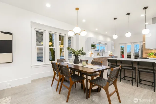 a view of a dining room and chandelier fan room view