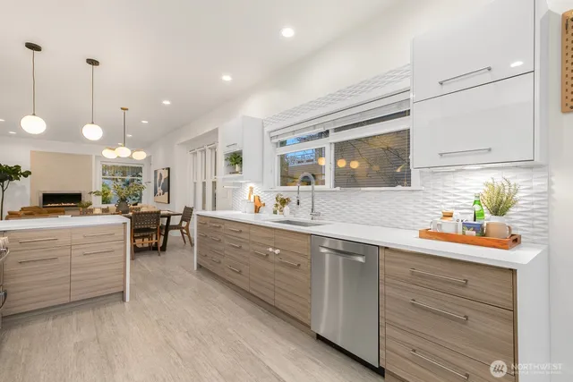 a kitchen with sink and cabinets