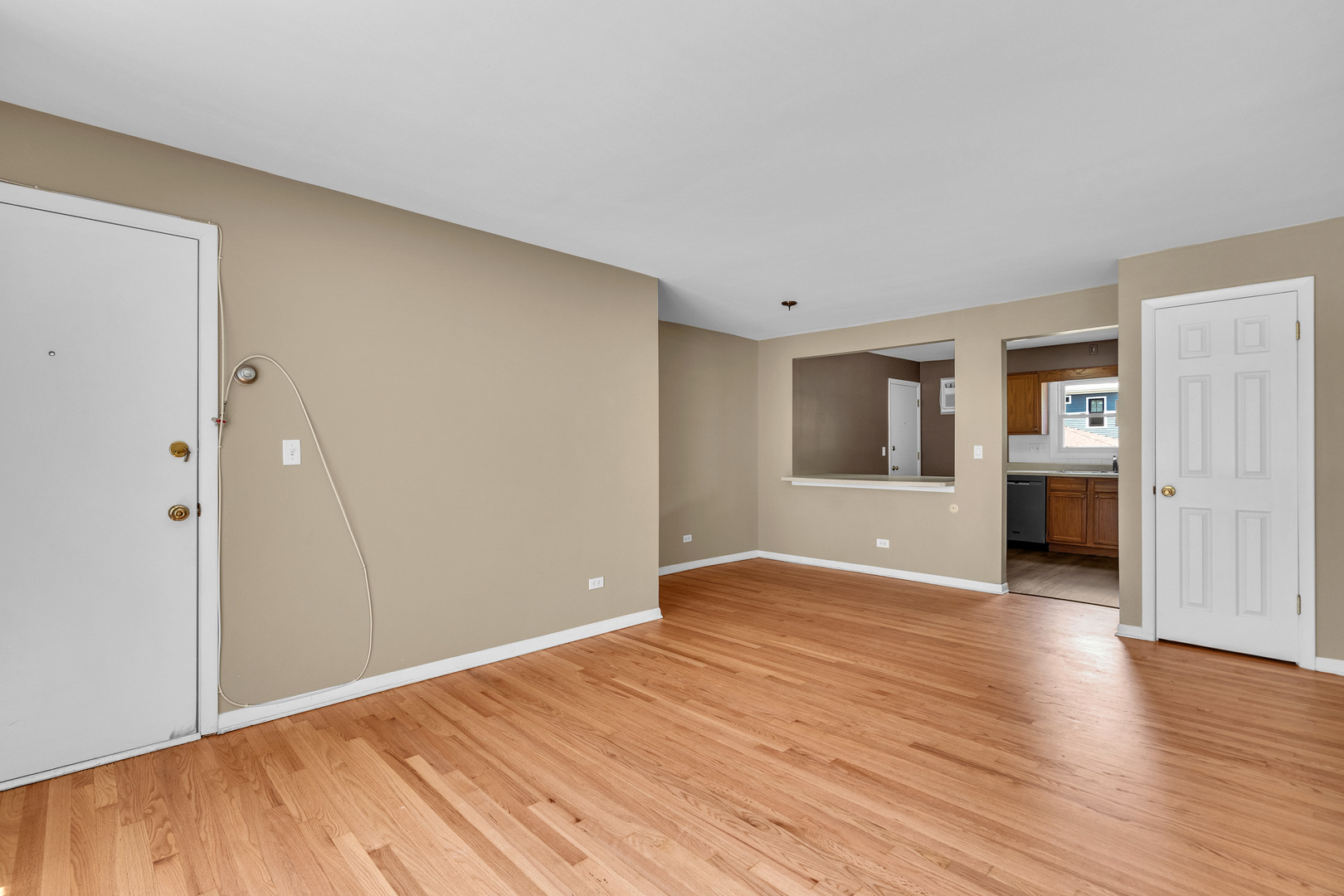 7952 Madison Street, Unit 2E River Forest, IL 60305 - Photo 6 of 25 a view of empty room with wooden floor and cabinet
