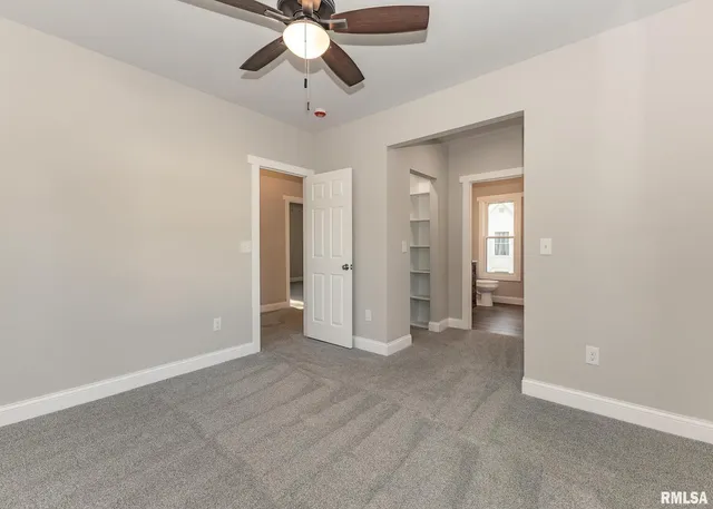 a view of a bathroom with a sink and mirror