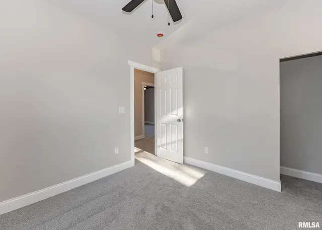 a kitchen with a sink and wooden cabinets