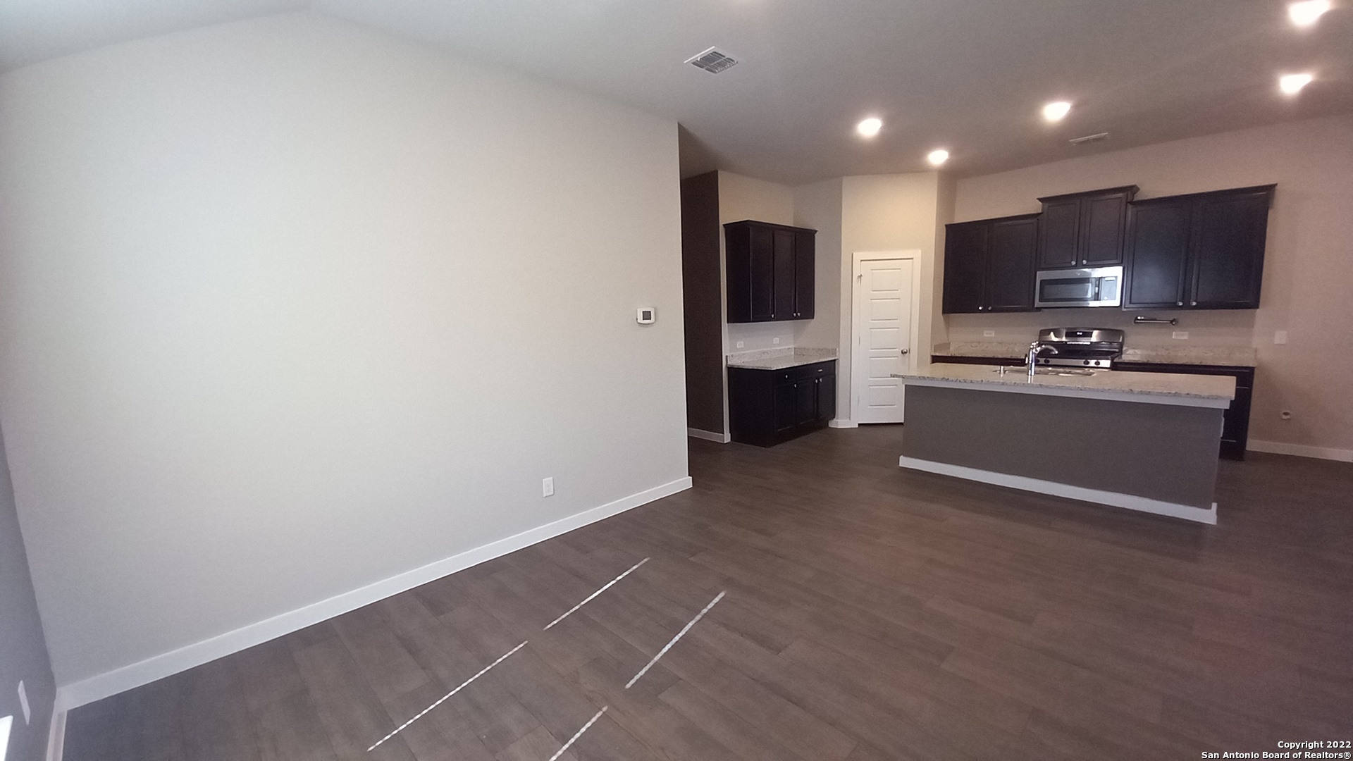 10571 Pablo Way Converse, TX 78109 - Photo 11 of 48 a view of a kitchen with a sink and a refrigerator