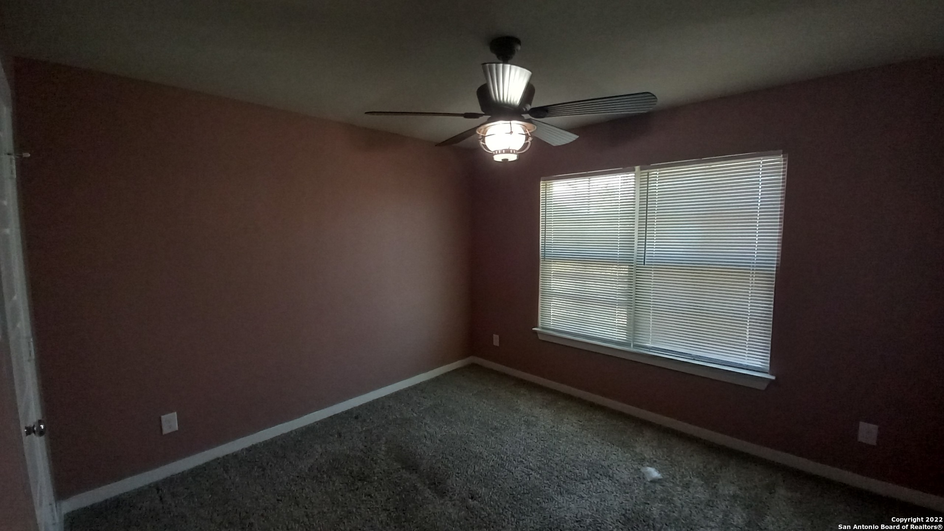 10571 Pablo Way Converse, TX 78109 - Photo 37 of 48 an empty room with a window and a fan