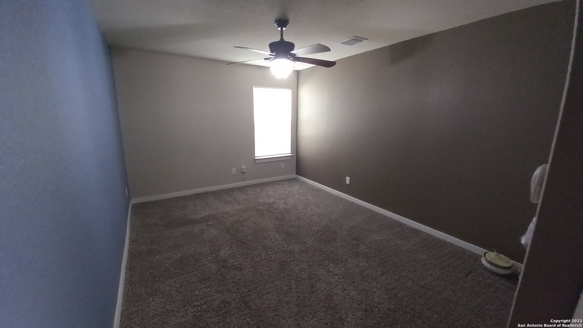 10571 Pablo Way Converse, TX 78109 - Photo 45 of 48 an empty room with a window and a fan