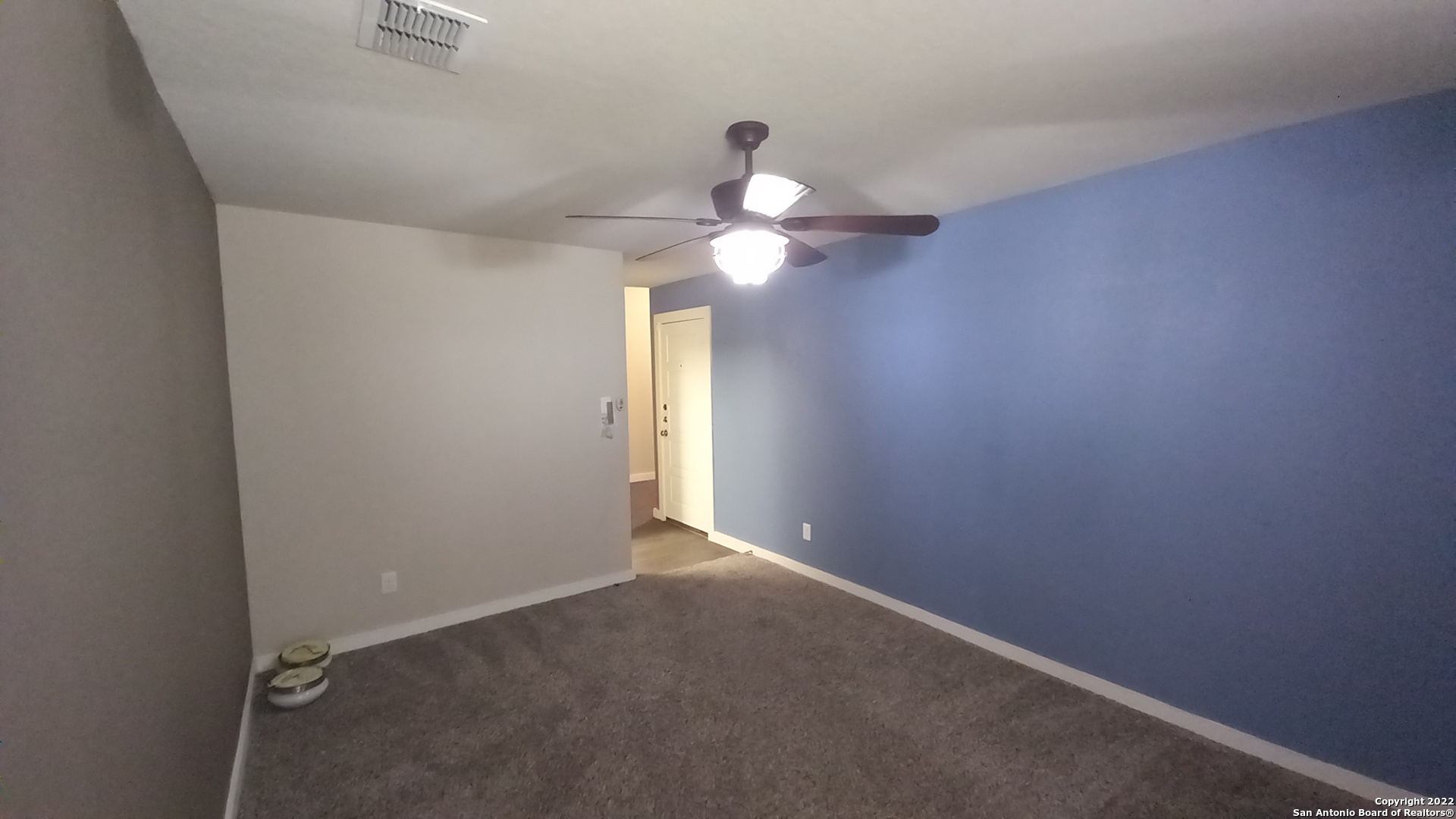 10571 Pablo Way Converse, TX 78109 - Photo 47 of 48 an empty room with a window and a chandelier fan