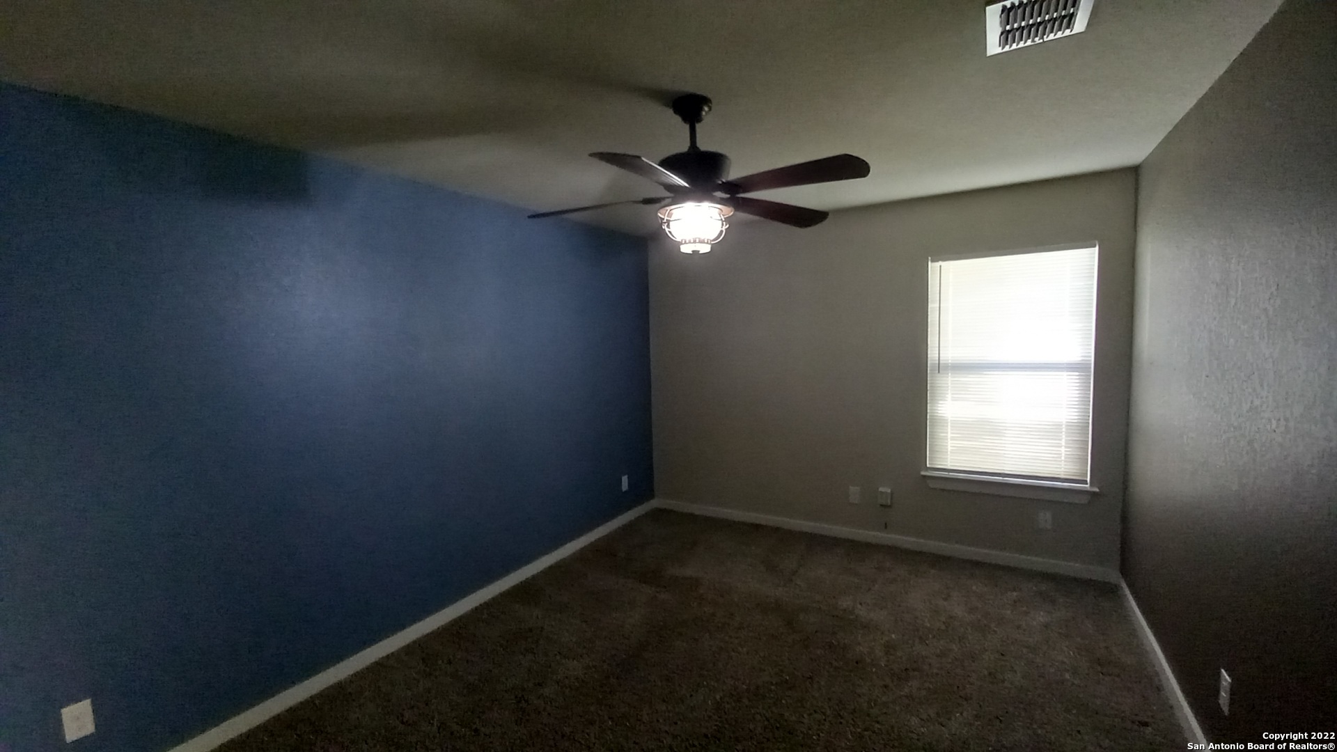 10571 Pablo Way Converse, TX 78109 - Photo 48 of 48 an empty room with a window and a fan