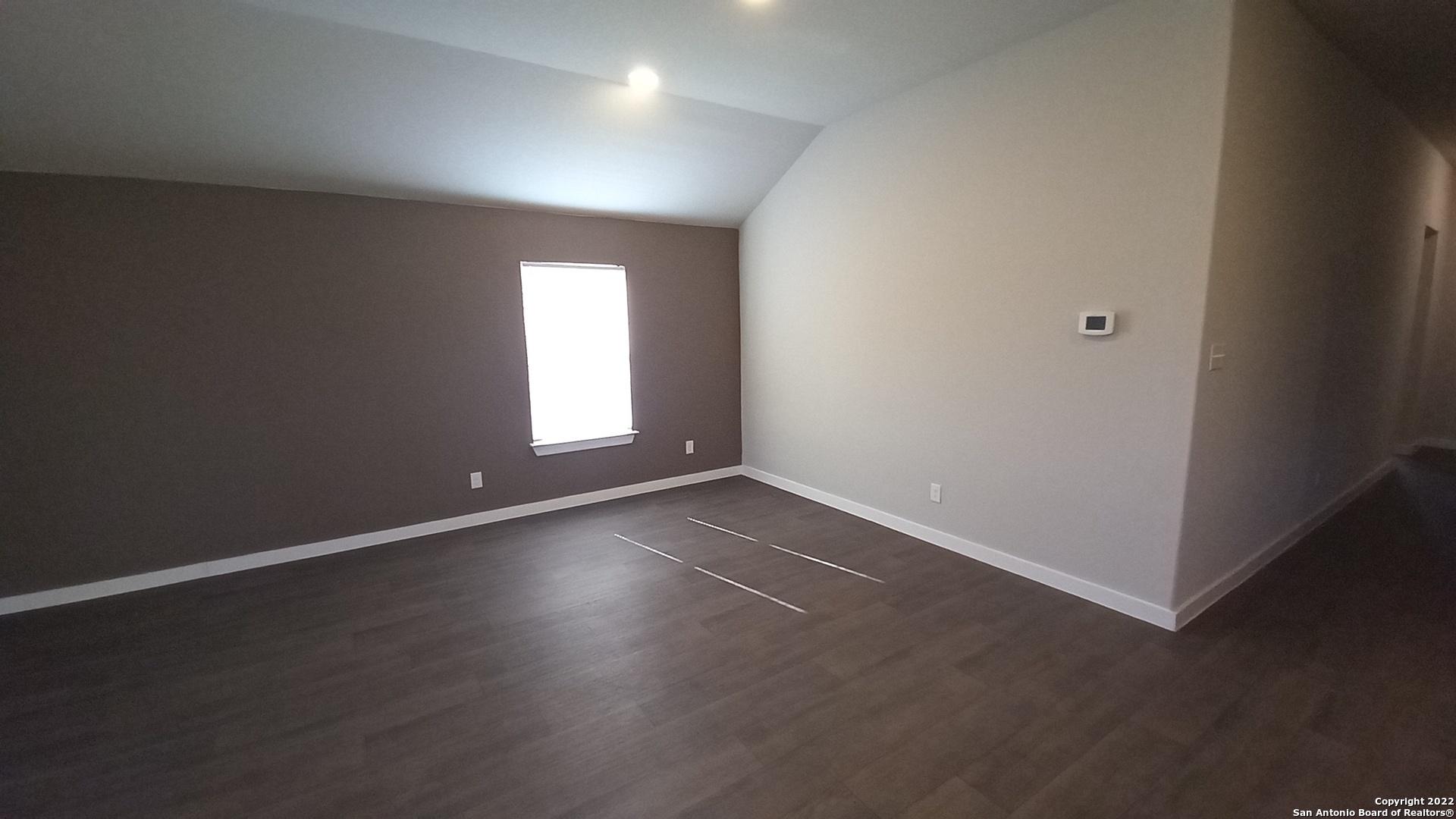 10571 Pablo Way Converse, TX 78109 - Photo 9 of 48 an empty room with wooden floor and windows
