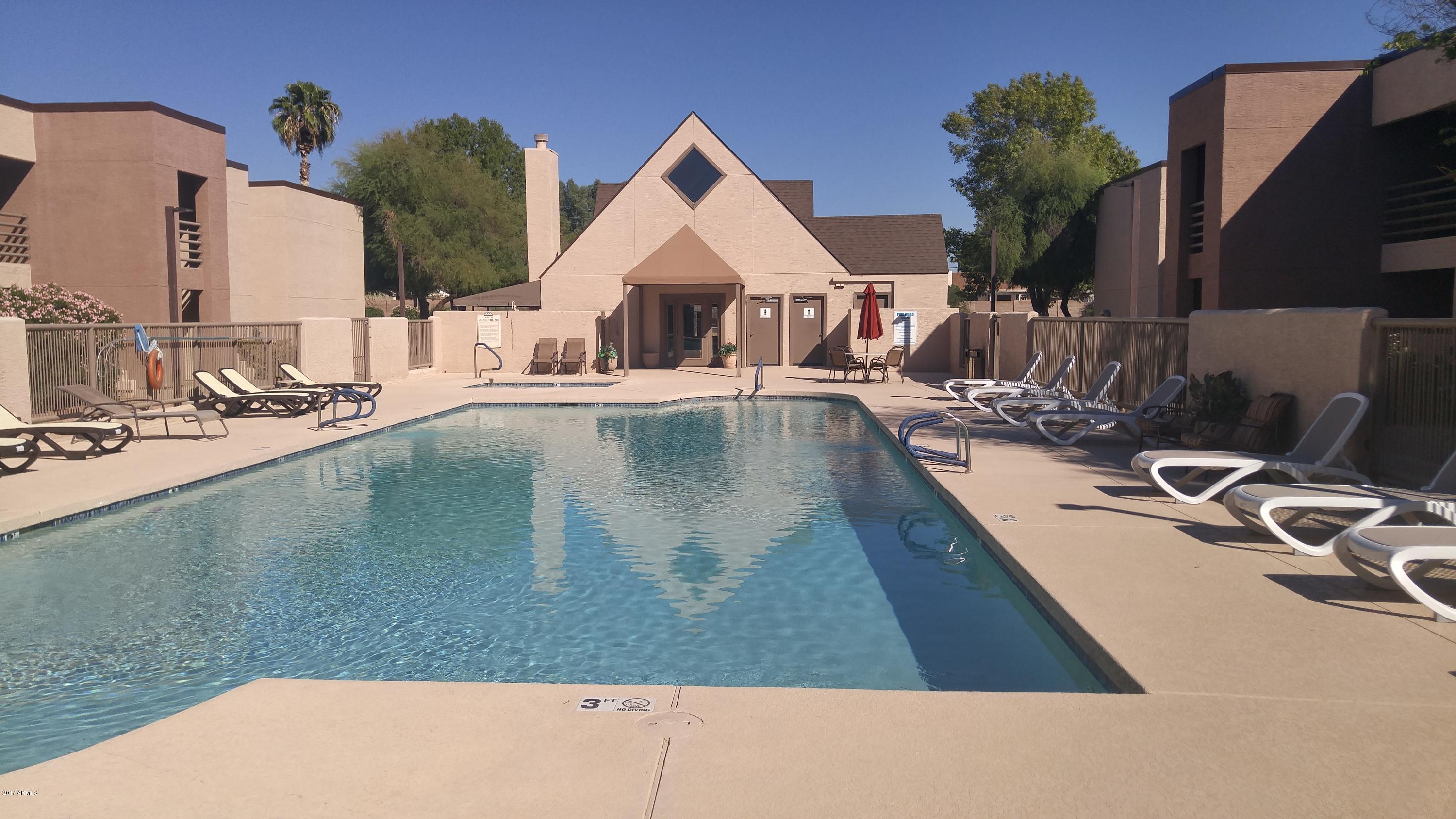a view of swimming pool with outdoor seating