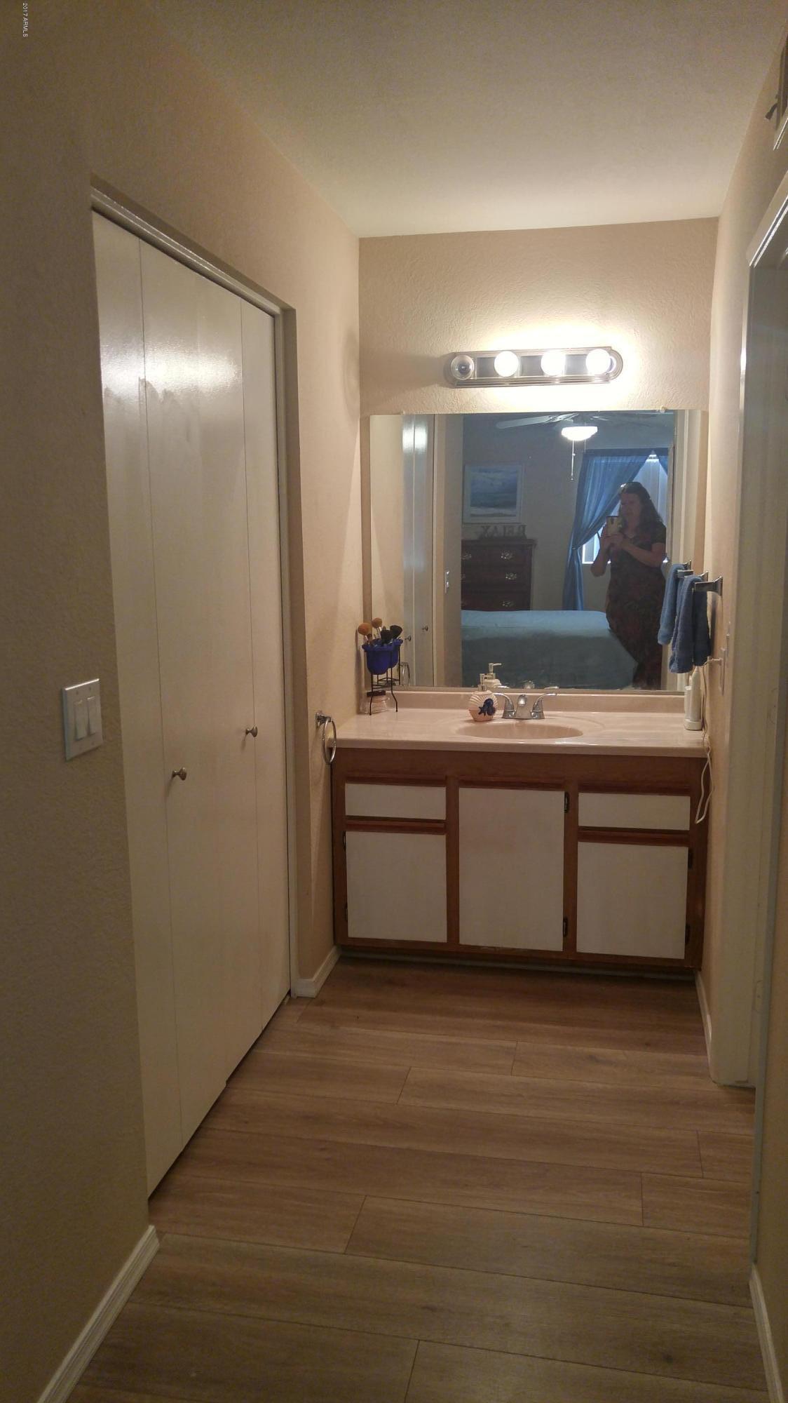 1340 North Recker Road, Unit 219 Mesa, AZ 85205 - Photo 27 of 41 a bathroom with a sink double vanity and a mirror