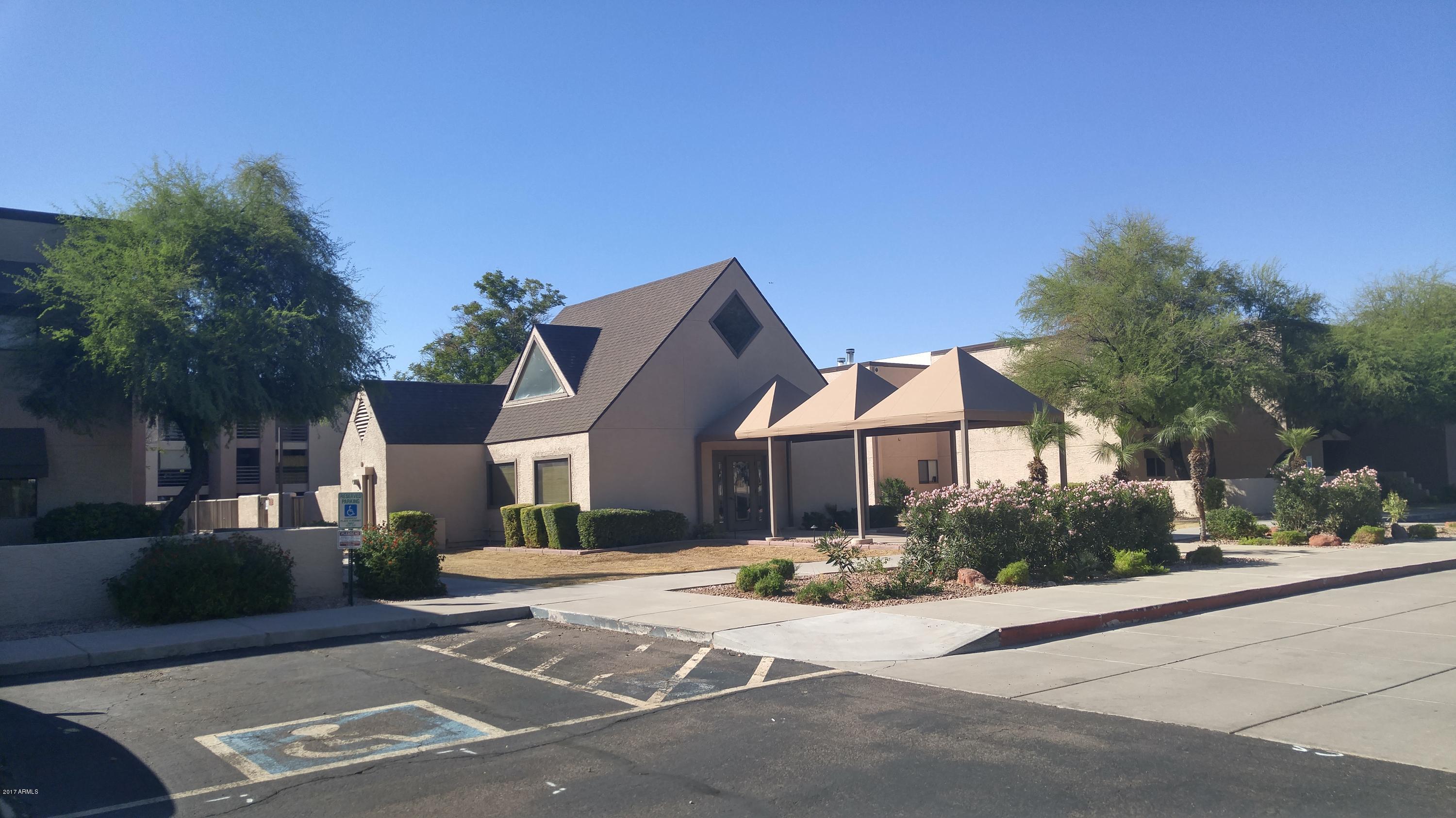 1340 North Recker Road, Unit 219 Mesa, AZ 85205 - Photo 3 of 41 front view of a house with a street