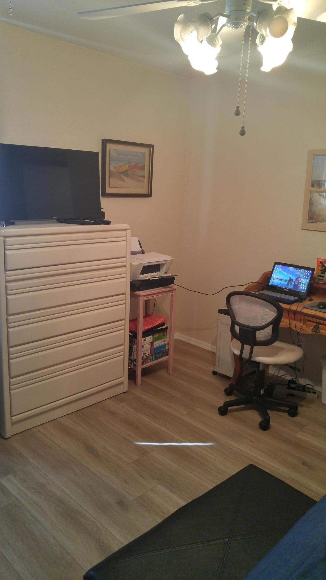 1340 North Recker Road, Unit 219 Mesa, AZ 85205 - Photo 32 of 41 a view of a workspace with furniture