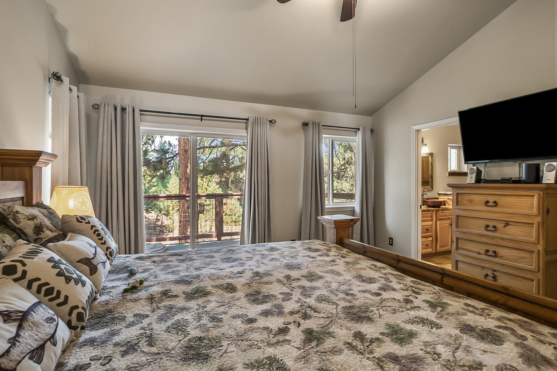 15730 Jackpine Road La Pine, OR 97739 - Photo 26 of 43 a bedroom with a bed and a flat screen tv