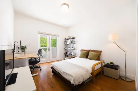 a bed room with a bed and a desk