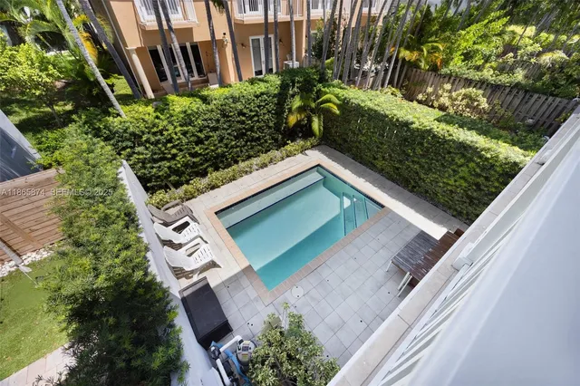 a view of a backyard with plants