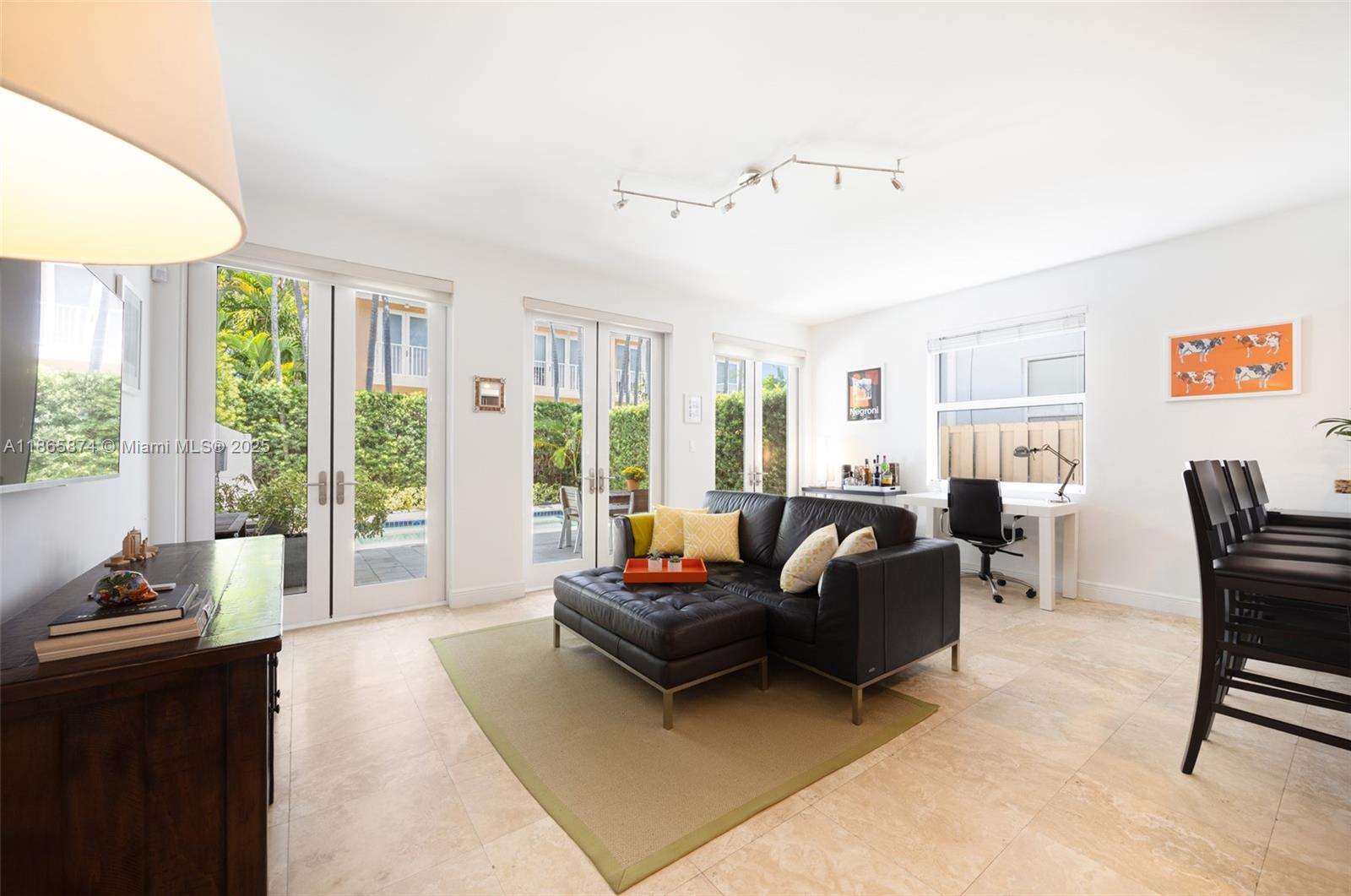 3109 Hibiscus Street, Unit 3109 Coconut Grove, FL 33133 - Photo 7 of 25 a living room with furniture and a large window