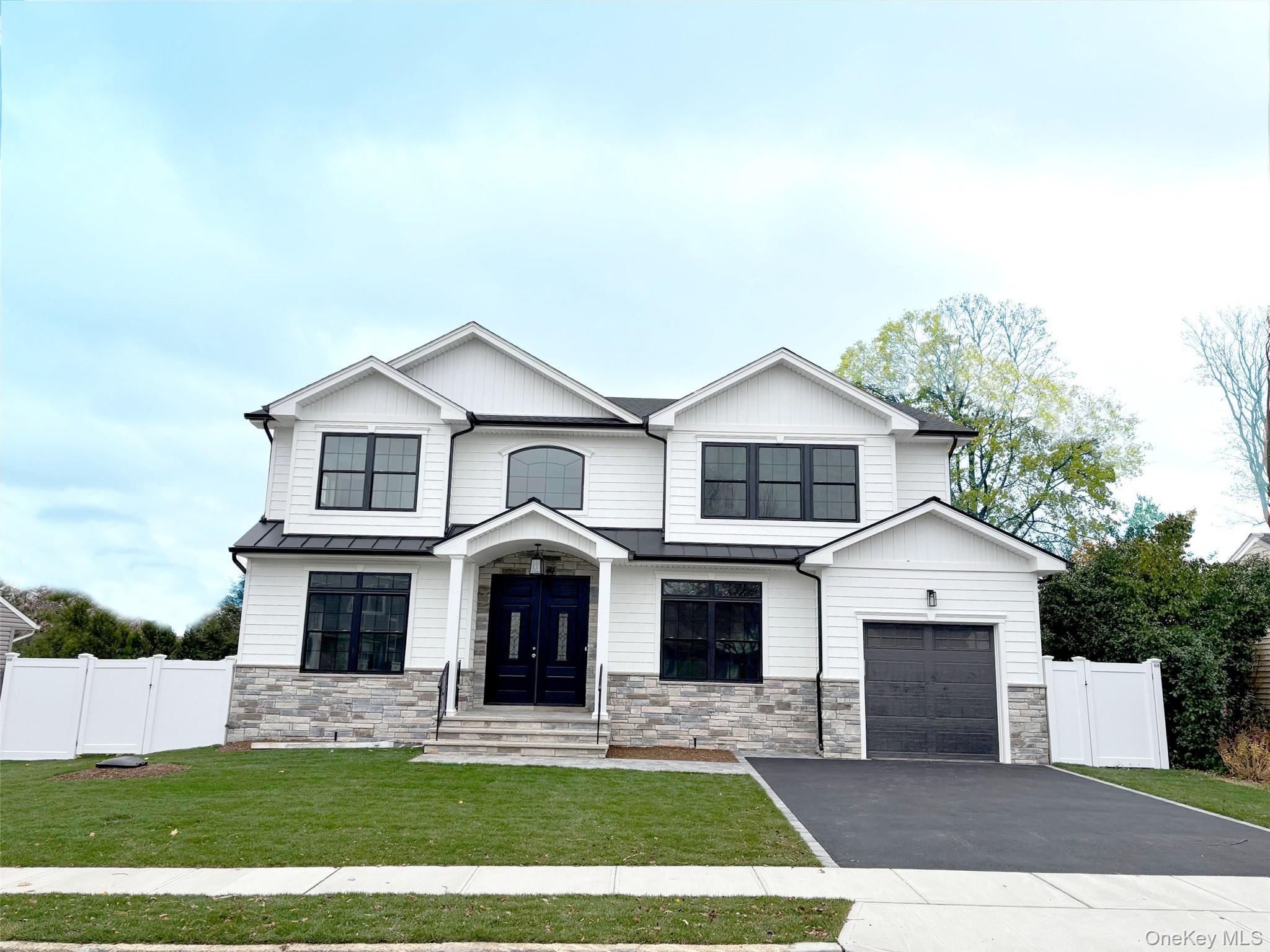 1750 Henry Road Merrick, NY 11566 - Photo 4 of 14 a view of house with yard and outdoor seating