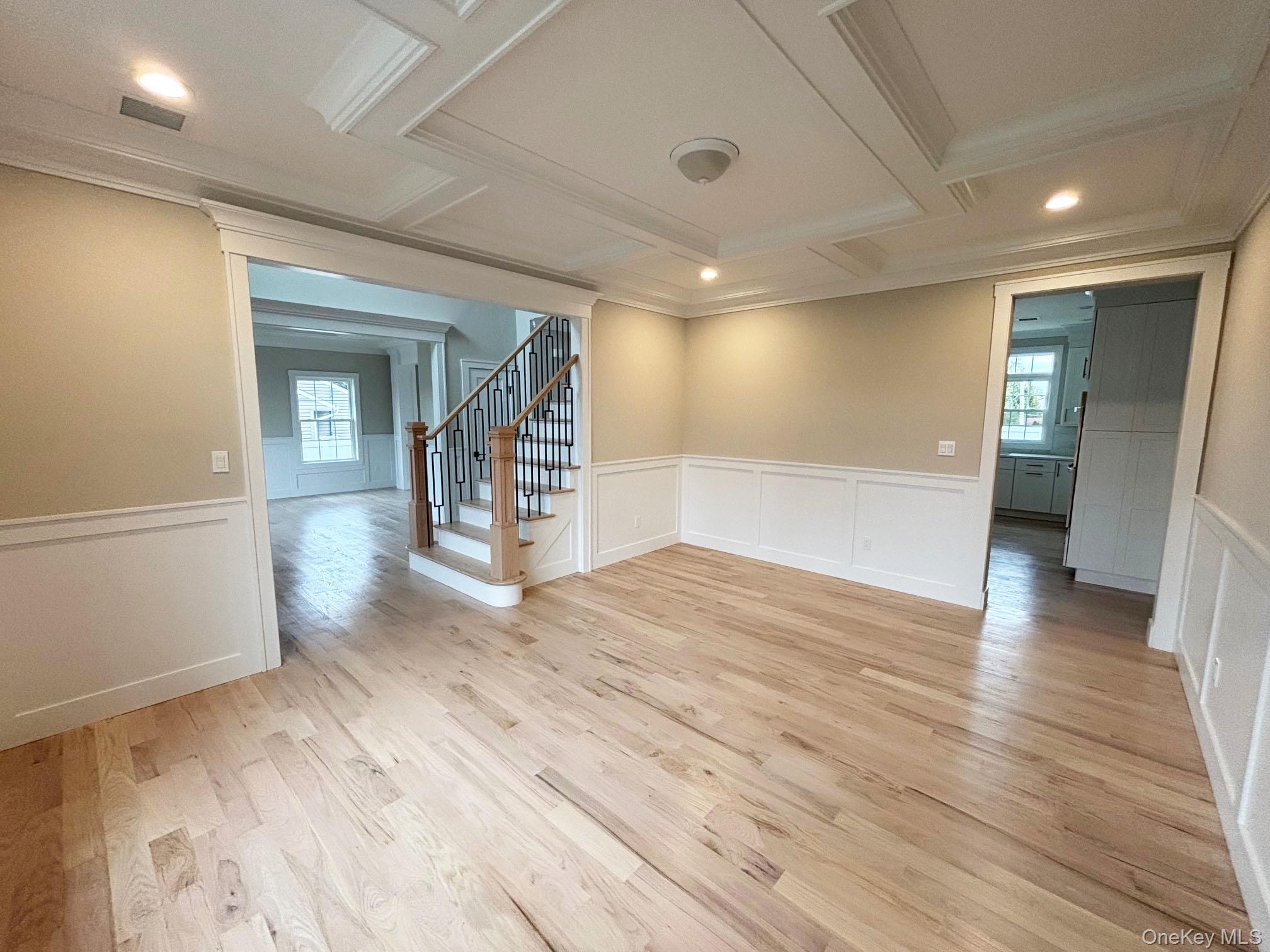1750 Henry Road Merrick, NY 11566 - Photo 5 of 14 a view of empty room with wooden floor