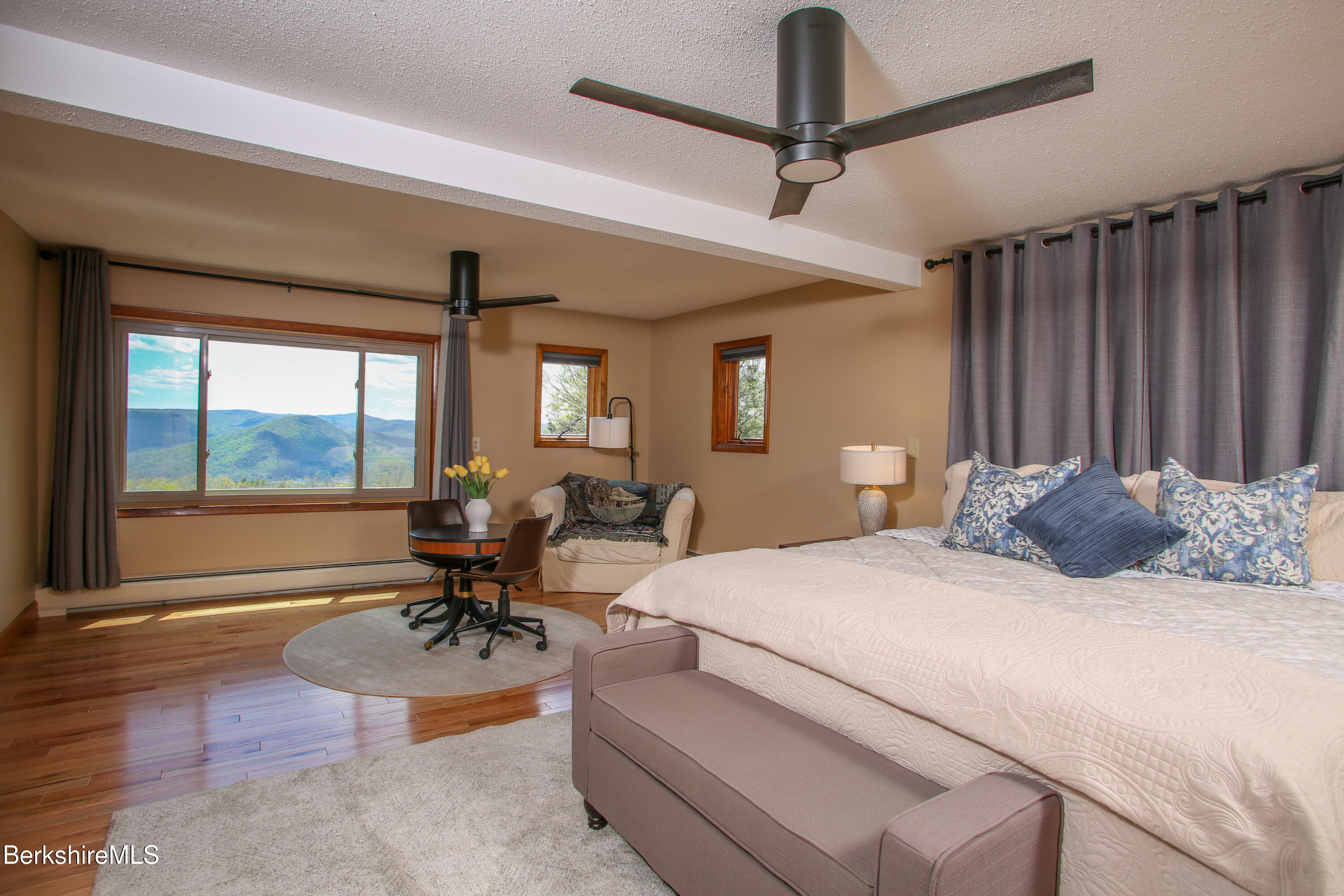 421 Legate Hill Road Charlemont, MA 01339 - Photo 23 of 37 a bedroom with a bed and glass door
