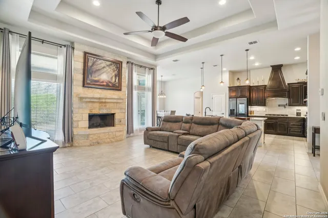 a kitchen with stainless steel appliances kitchen island granite countertop a sink and cabinets