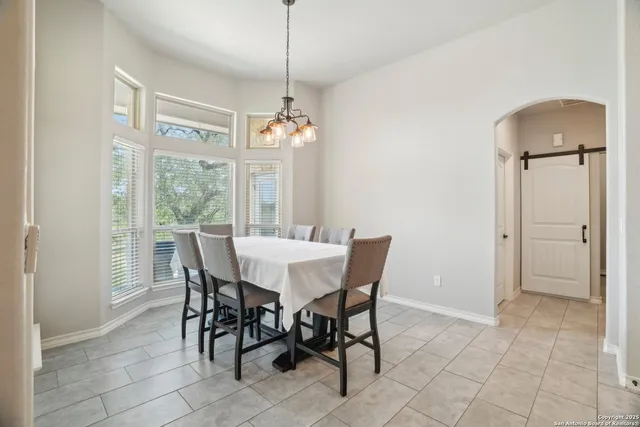 a view of a livingroom with furniture and an empty room