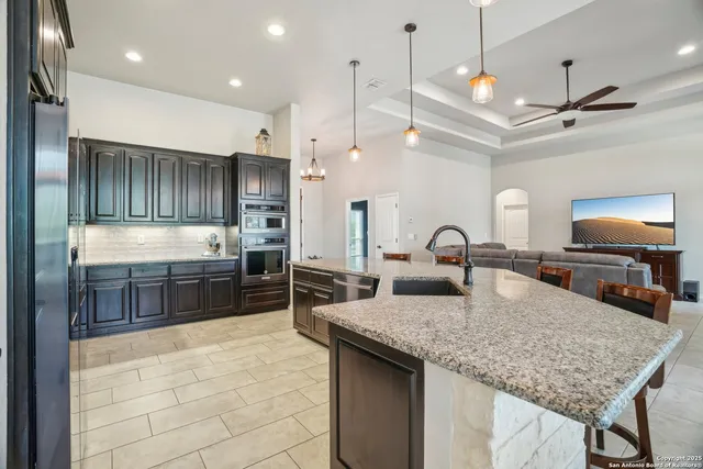 an empty room with fan and windows