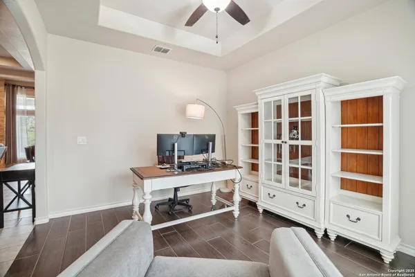 a bathroom with a granite countertop sink and mirror