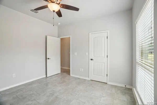 a bedroom with a bed and a television