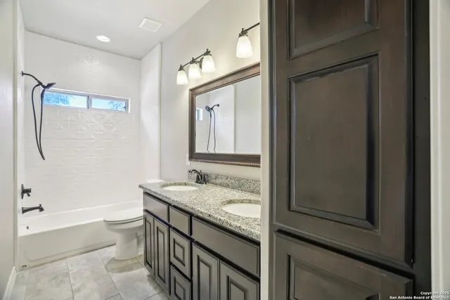 a bedroom with a bed dresser and a window