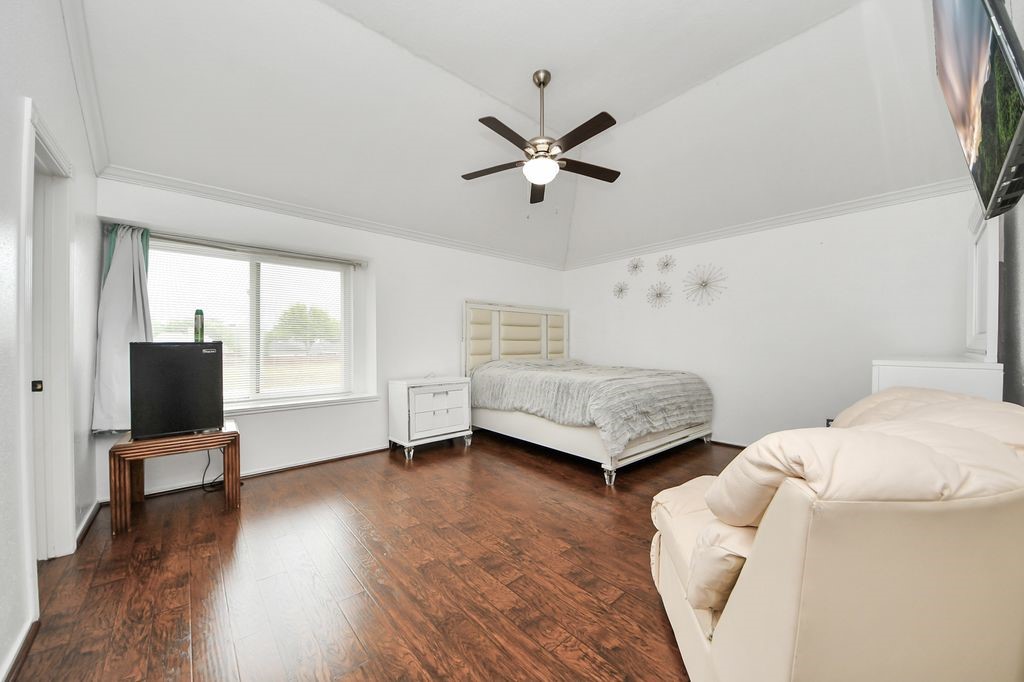 16506 Crossfield Drive Houston, TX 77095 - Photo 11 of 21 a bedroom with furniture and a window