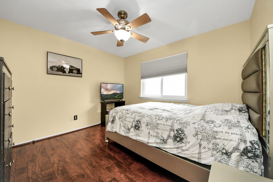 16506 Crossfield Drive Houston, TX 77095 - Photo 13 of 21 a bed sitting in a spacious bedroom next to a window