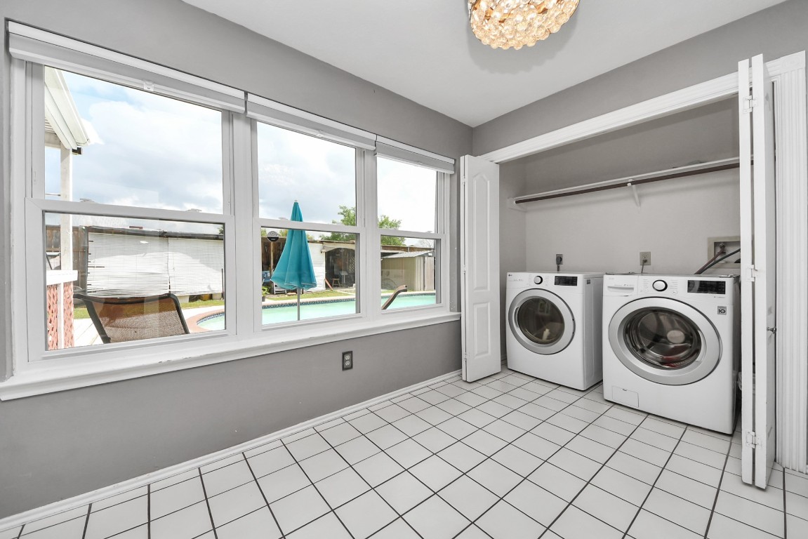 16506 Crossfield Drive Houston, TX 77095 - Photo 14 of 21 a utility room with dryer washer and a window
