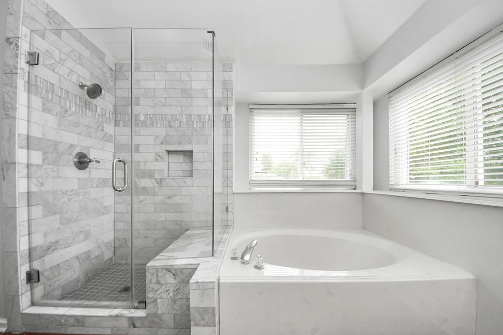 16506 Crossfield Drive Houston, TX 77095 - Photo 16 of 21 a white bath tub sitting next to a shower