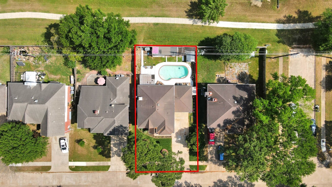 16506 Crossfield Drive Houston, TX 77095 - Photo 8 of 21 an aerial view of a house with a lake and a building in the back