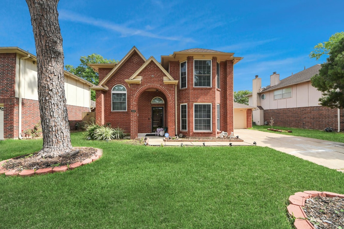 16506 Crossfield Drive Houston, TX 77095 - Photo 9 of 21 a front view of a house with a yard