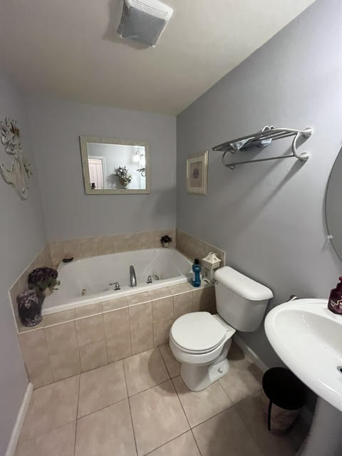 2212 Rising Hill Road Whitehall, PA 18052 - Photo 18 of 21 Relax in the deep soaking tub of this private, well-appointed primary bathroom.