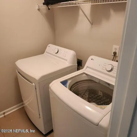 a utility room with dryer and washer