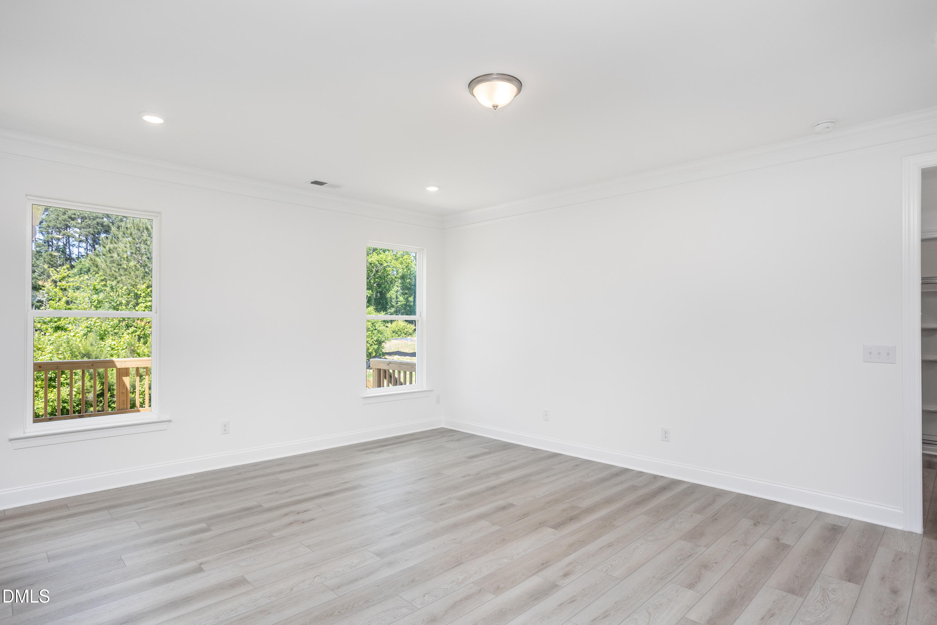 216 Cedar Rdg Trail Angier, NC 27501 - Photo 15 of 33 an empty room with wooden floor and window