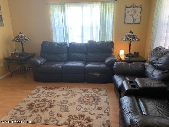 15344 Davidson Farm Road West Jacksonville, FL 32218 - Photo 12 of 25 a living room with furniture and a window