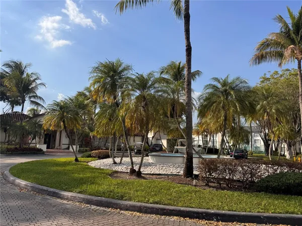 a view of outdoor space with palm trees