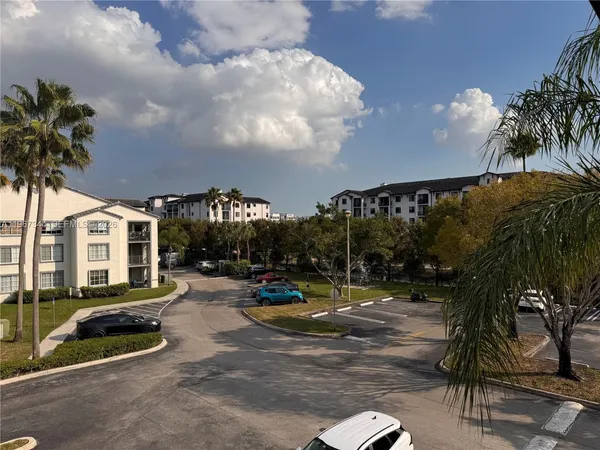 a view of a park with swings and slides